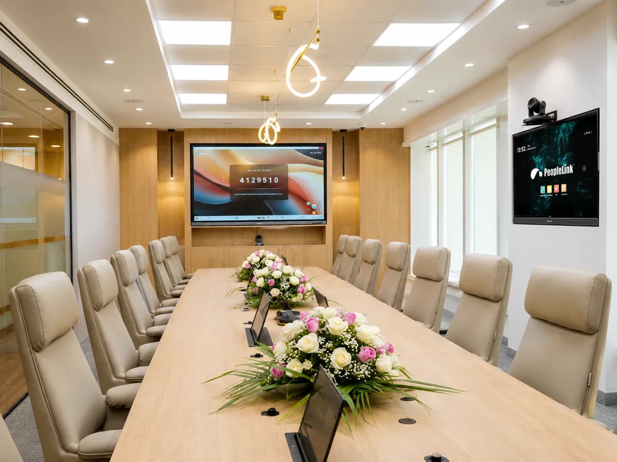 Executive boardroom with cream chairs, interactive display and side display