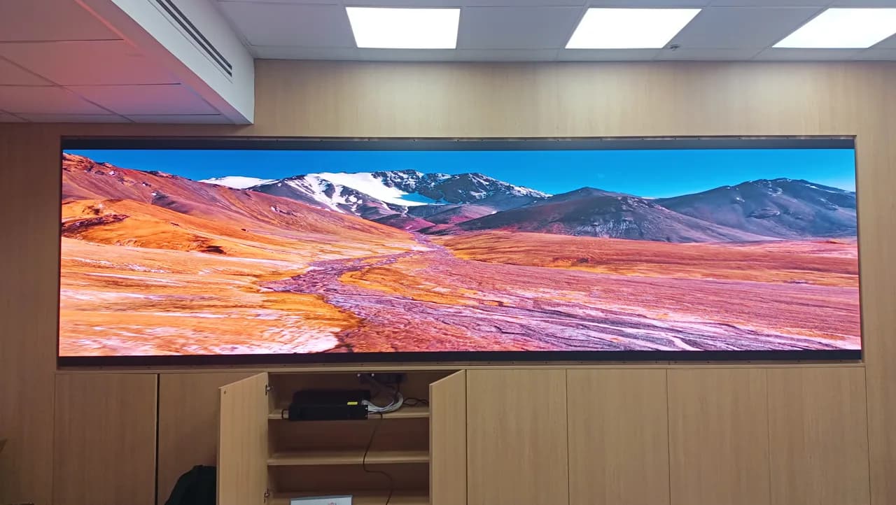 Ultra-wide Active LED wall showing a mountain landscape in an office