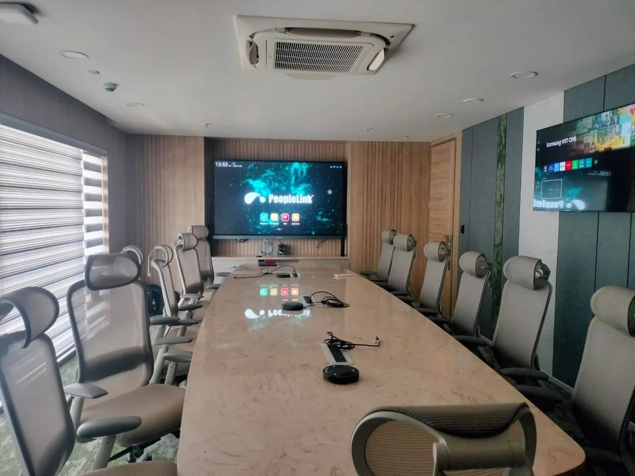 Boardroom with interactive display, camera and table microphones